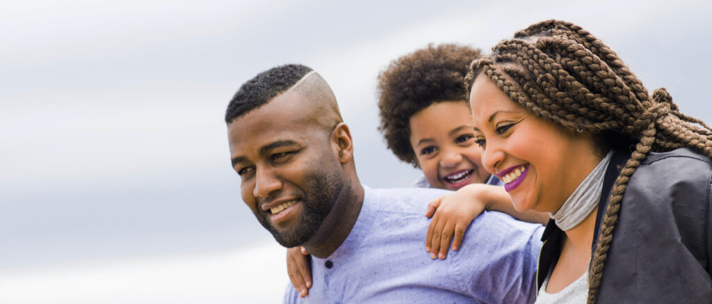 African american young family with one child having fun smiling - Lifestyles
